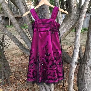 Magenta children’s dress with black lace